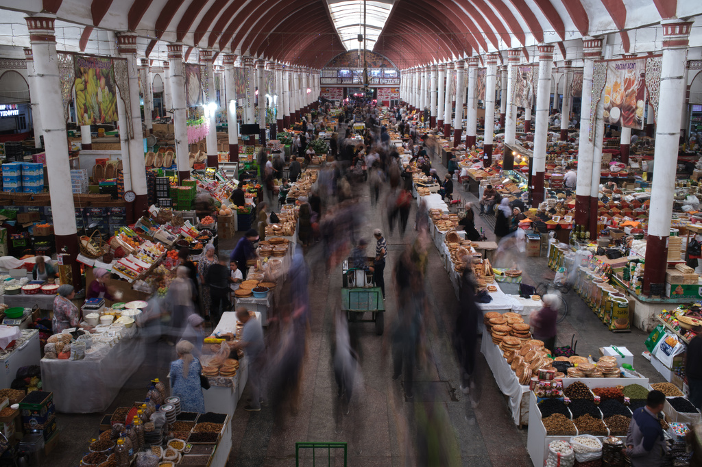 People traverse Panjshanbe Bazaar in Khujand, Tajikistan, Sunday, May 3, 2026. (AP Photo/Jon Orbach)