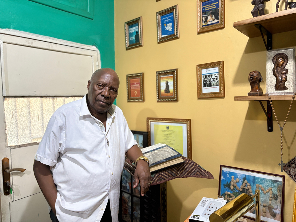 Bwatshia Kambayi, a Congolese scholar and former higher education minister who has written about Kimbanguism, poses at his home in Kinshasa, Democratic Republic of the Congo, Sunday, April 5, 2026. (AP Photo/Rodney Muhumuza)