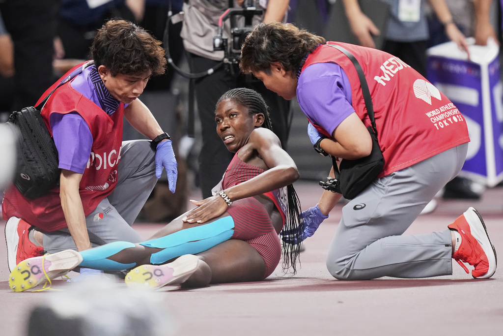 Medics attend to Kenya's Sarah Moraa during women's 800 meters semifinal at the World Athletics Championships in Tokyo, Friday, Sept. 19, 2025. (AP Photo/Eugene Hoshiko)
