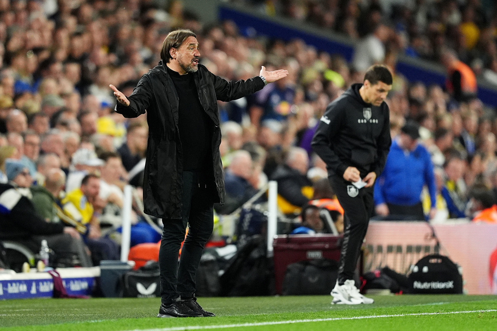 Leeds United manager Daniel Farke, left, gestures during the Premier League match between Leeds United and Burnley, in Leeds, England, Friday, May 1, 2026. (Martin Rickett/PA via AP)