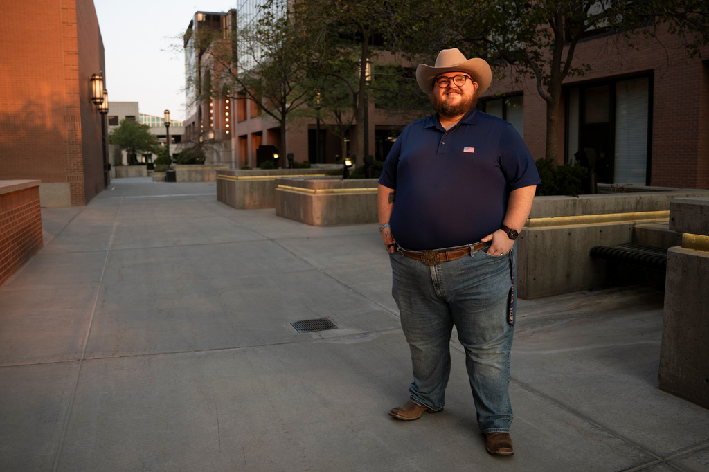 Giles Sims, who is getting a 90-hour bachelor of applied science in communication from Ensign College poses for a portrait on campus in Salt Lake City, Utah Thursday, Aug. 6, 2026, in Salt Lake City. (AP Photo/Marielle Scott)