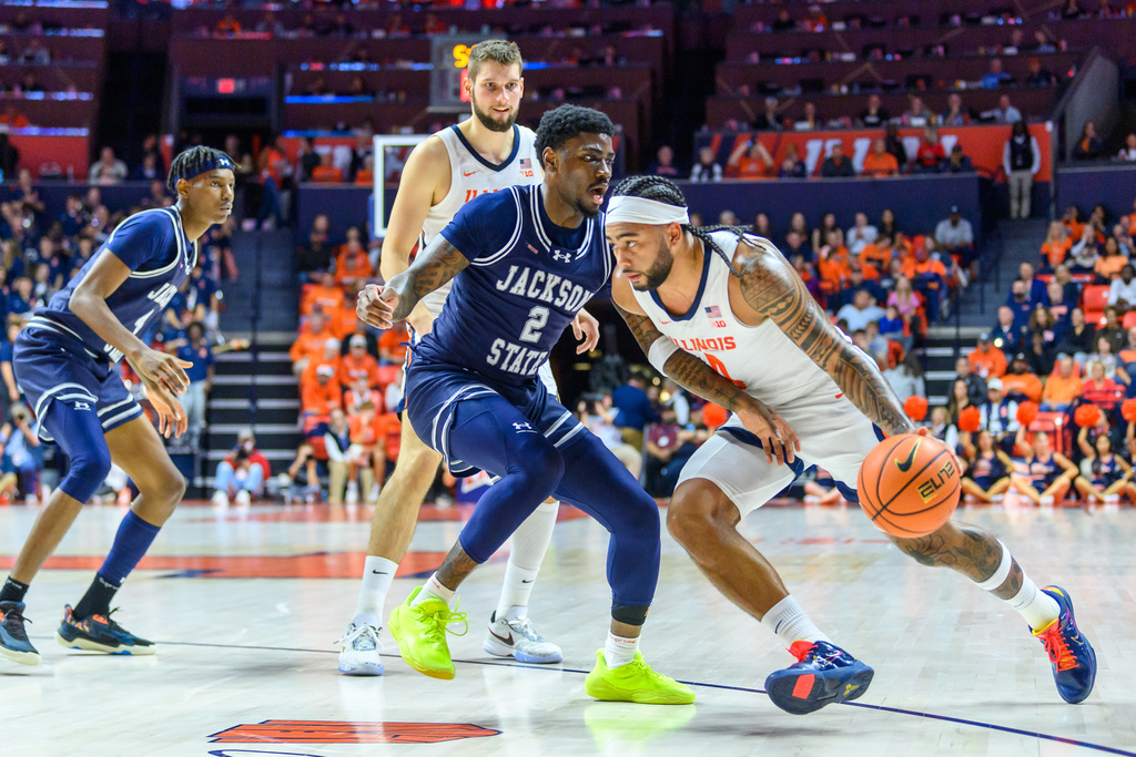Illinois' Kylan Boswell drives against Jackson State's Jalen Tatum during an NCAA college basketball game, Monday, Nov. 3, 2025, in Champaign, Ill. (AP Photo/Craig Pessman)