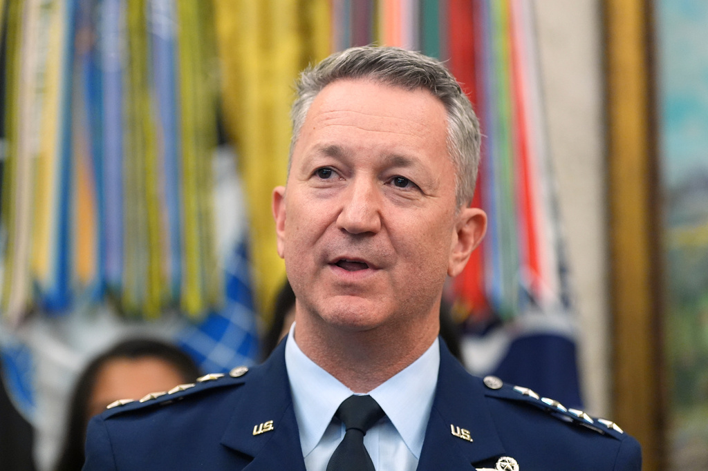 Gen. Dan Caine, chairman of the Joint Chiefs of Staff, speaks during a meeting about military families with President Donald Trump, in the Oval Office of the White House, Monday, Aug. 3, 2026, in Washington. (AP Photo/Alex Brandon)