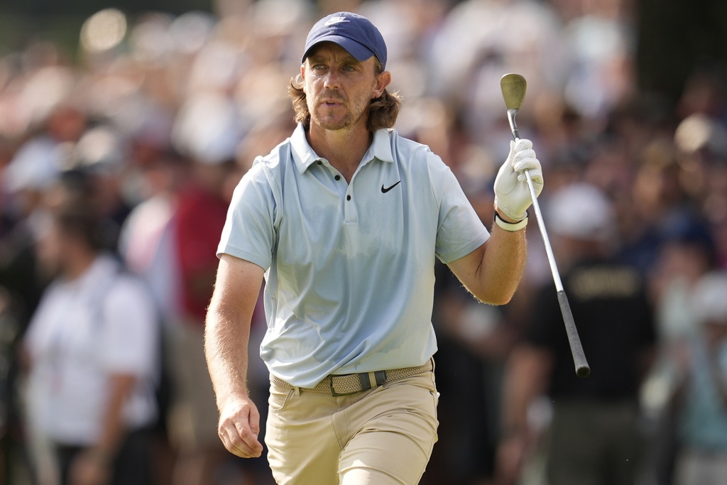 Tommy Fleetwood, of England, walks up to the 18th green during the final round of the Tour Championship golf tournament, Sunday, Aug. 24, 2025, in Atlanta. (AP Photo/Mike Stewart)