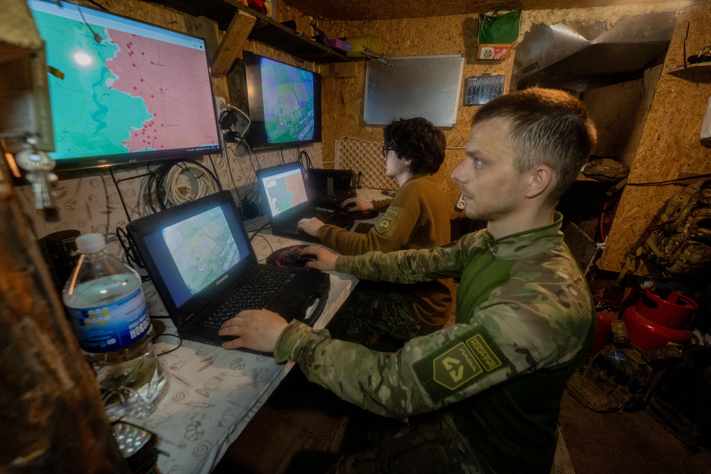 Ukrainian servicemen of Khartia brigade check the drone aerial view in the command centre Kharkiv region, Ukraine, Wednesday, May 20, 2026. (AP Photo/Andrii Marienko)