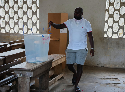 A man casts his ballot during the presidential elections in Abidjan, Ivory Coast, Saturday, Oct. 25, 2025. (AP Photo/Misper Apawu) A man casts his ballot during the presidential elections in Abidjan, Ivory Coast, Saturday, Oct. 25, 2025. (AP Photo/Misper Apawu)