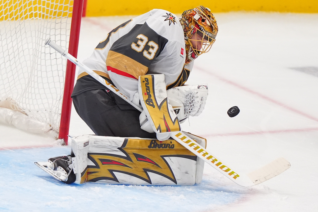Vegas Golden Knights goaltender Adin Hill defends the net during the third period of an NHL hockey game against the Dallas Stars, Sunday, March 22, 2026, in Dallas. (AP Photo/LM Otero)