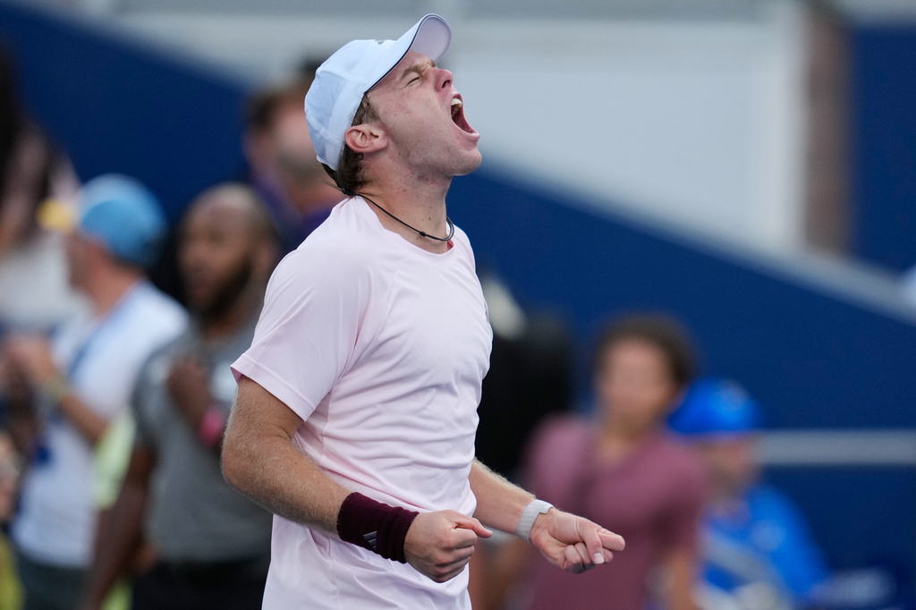 Alex Michelsen, of the United States, reacts after he won his match against Tomas Martin Etcheverry, of Argentina, during the fourth round of the U.S. Open tennis championships Sunday, Sept. 6, 2026, in New York. (AP Photo/Seth Wenig)