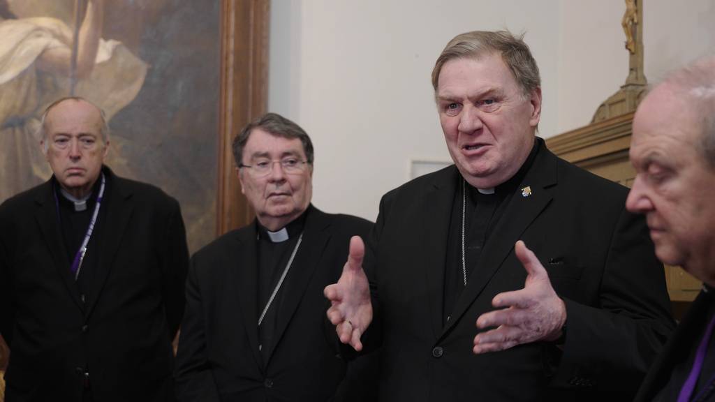 Cardinals Robert McElroy, Christophe Pierre, Joseph Tobin and Archbishop Bernard Hebda, and speak to reporters after a mass in solidarity with migrants at the Chapel of St. Thomas Aquinas on Friday, Feb. 27, 2026 in St. Paul, Minn. (AP Photo/Mark Vancleave)