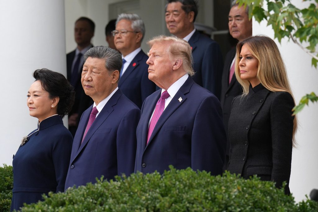 President Donald Trump, first lady Melania Trump, China's President Xi Jinping and his wife Peng Liyuan watch a military review in the Rose Garden of the White House, Thursday, Sept. 24, 2026, in Washington. (AP Photo/Jacquelyn Martin)