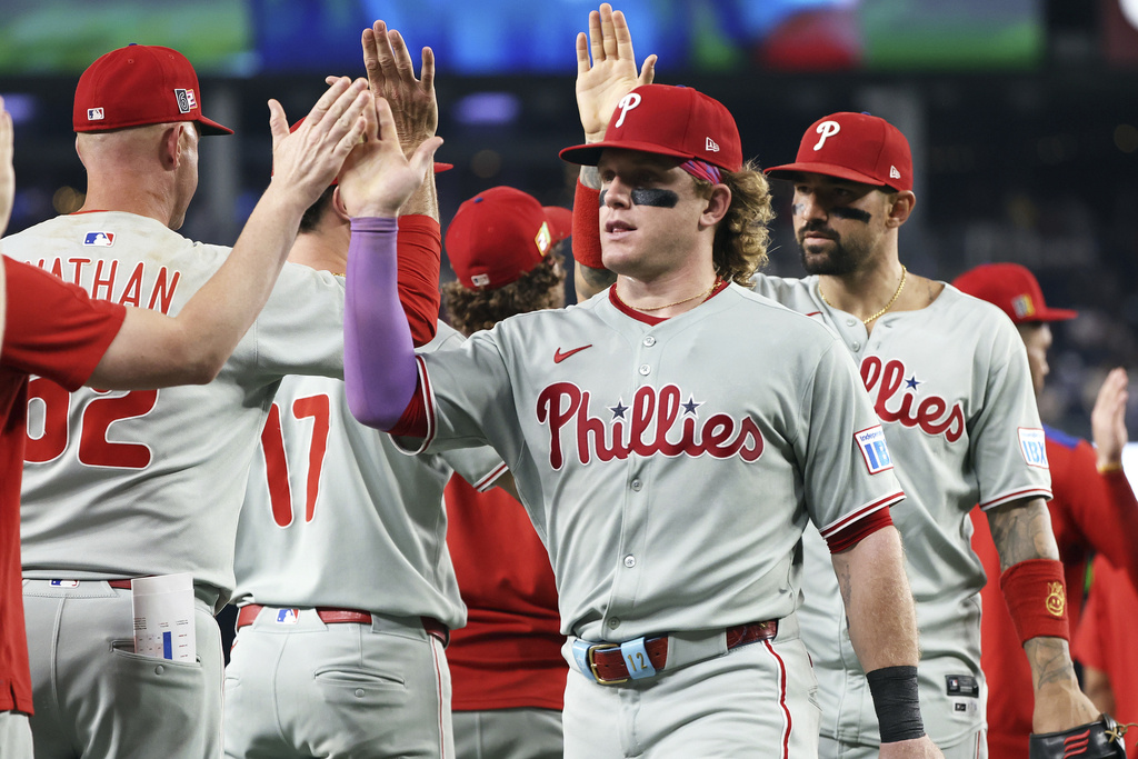 The Philadelphia Phillies celebrate after a baseball game against the Washington Nationals, Friday, Aug. 15, 2025, in Washington. (AP Photo/Daniel Kucin Jr.)
