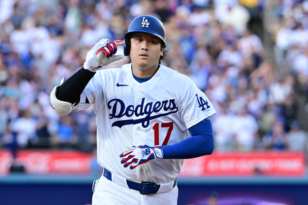 Los Angeles Dodgers Shohei Ohtani (17) celebrates his solo home run against the Seattle Mariners during the first inning of a baseball game Tuesday, July 28 2026, in Los Angeles. (AP Photo/Wally Skalij)