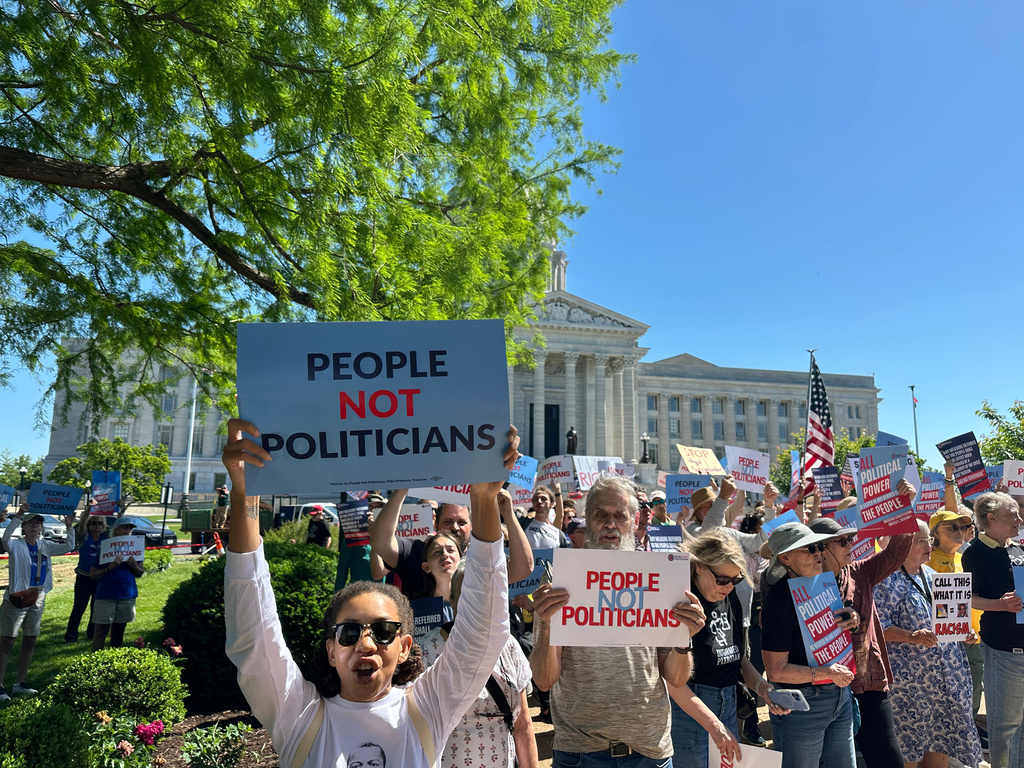 Protesters against a Missouri congressional redistricting plan gather outside the Missouri Capitol on Tuesday, May 12, 2026, in Jefferson City, Mo. (AP Photo/David A. Lieb)