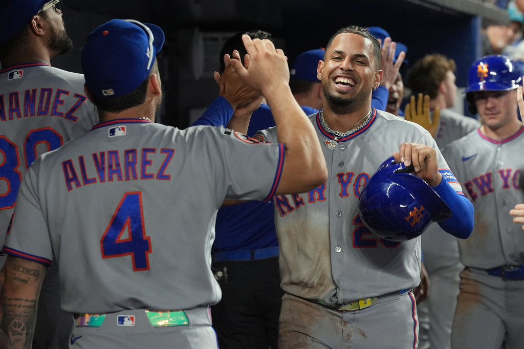 New York Mets' Christopher Morel celebrates after scoring during the second inning of a baseball game against the Miami Marlins Wednesday, Sept. 9, 2026, in Miami. (AP Photo/Marta Lavandier)