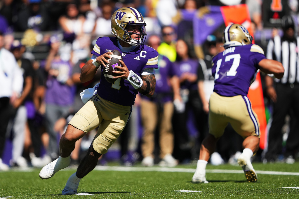 Washington quarterback Demond Williams Jr. looks to throw against Washington State during the first half of an NCAA college football game, Sunday, Sept. 6, 2026, in Seattle. (AP Photo/Lindsey Wasson)