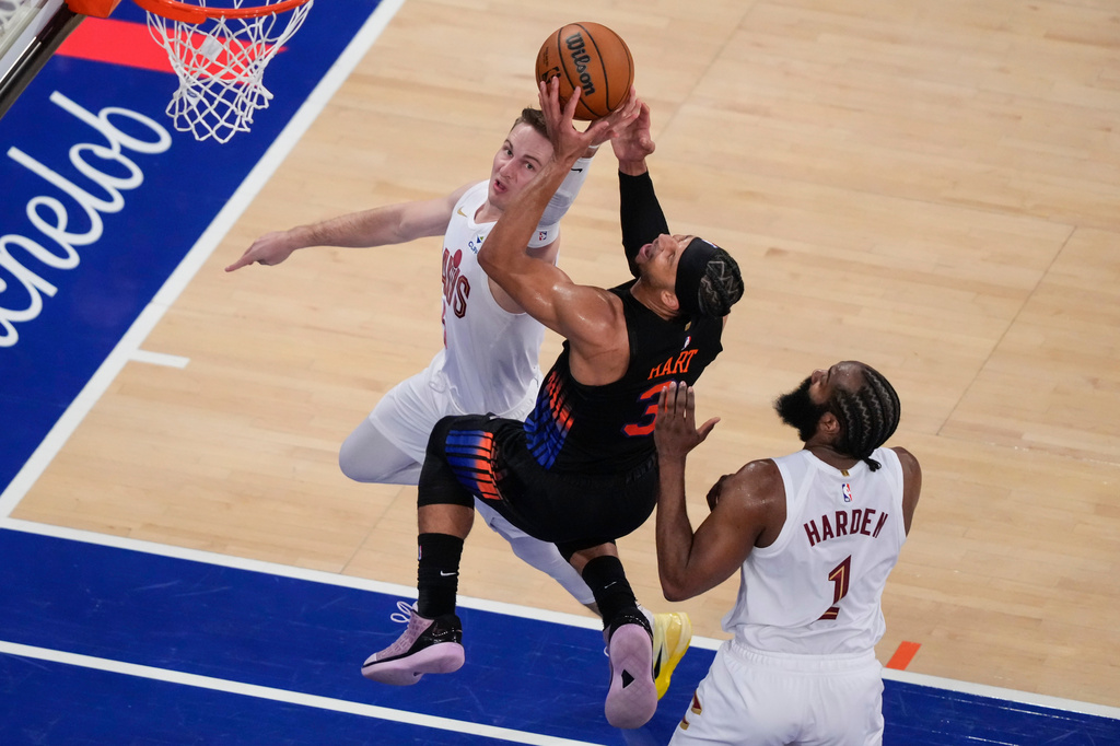 New York Knicks guard Josh Hart (3) is blocked by Cleveland Cavaliers guard Sam Merrill (5) during the second half of Game 2 in the Eastern Conference finals NBA basketball playoffs series, Thursday, May 21, 2026, in New York. (AP Photo/Yuki Iwamura)