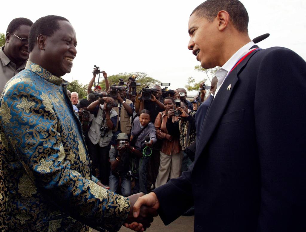 Kenya's opposition leader Raila Odinga, left, and U.S. Sen. Barack Obama shake hands as they meet in Kisumu, Kenya, Friday, Aug. 25, 2006. (AP Photo/Sayyid Azim)