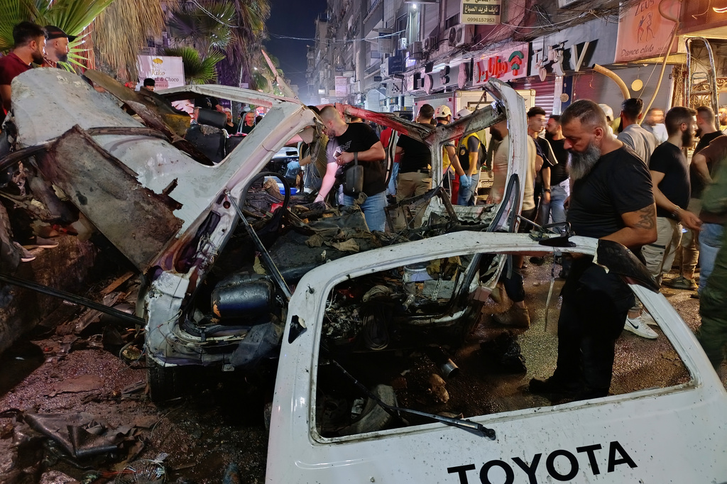 Syrian security personnel inspect damaged vehicles at the site of an explosion in the Jaramana suburb, home to a large Druze population, in Damascus, Syria, Thursday, Aug. 6, 2026. (AP Photo/Abdulrahman Shaheen)