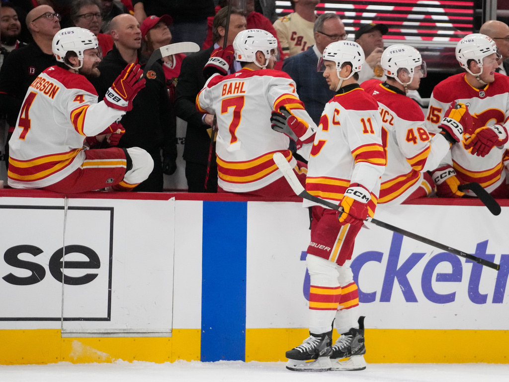 Calgary Flames center Mikael Backlund (11) celebrates his goal on the Chicago Blackhawks during the first period of an NHL hockey game Thursday, Jan. 15, 2026, in Chicago. (AP Photo/Erin Hooley)