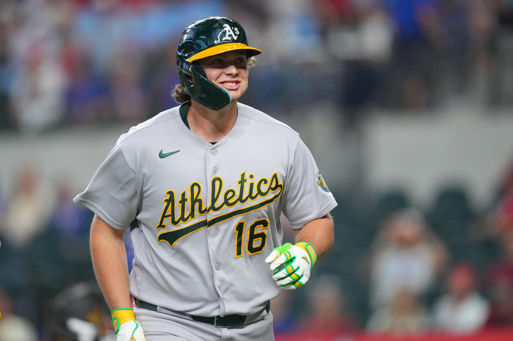 Athletics' Nick Kurtz reacts after hitting a solo home run on the first pitch of the game against Texas Rangers starting pitcher Nathan Eovaldi during a baseball game Friday, April 24, 2026, in Arlington, Texas. (AP Photo/Julio Cortez)