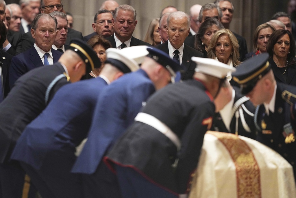 Former Presidents front row from left, George W. Bush with Laura Bush and Joe Biden with Jill Biden, and other invited dignitaries, look on during the funeral for former Vice President Dick Cheney at the Washington National Cathedral on Thursday, Nov. 20, 2025 in Washington. (AP Photo/Matt Rourke)