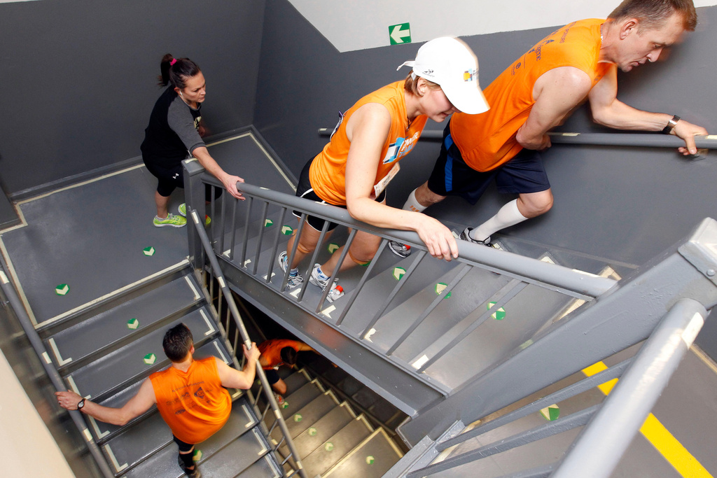 FILE - Participants make make their way up 86 flights of stairs during the 35th Annual Empire State Building Run-Up in New York, on Wednesday, Feb. 8, 2012. (AP Photo/Jason DeCrow, File)
