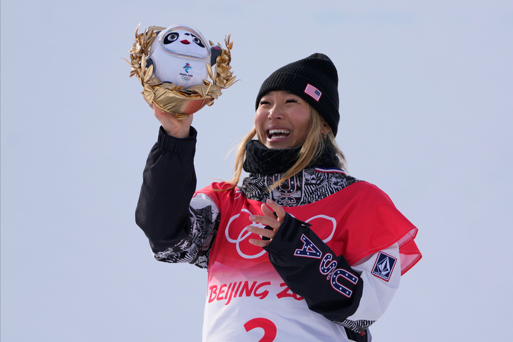 FILE - Gold medal winner Chloe Kim, of the United States, celebrates during the venue ceremony for the women's halfpipe at the 2022 Winter Olympics, Feb. 10, 2022, in Zhangjiakou, China. (AP Photo/Lee Jin-man, File)