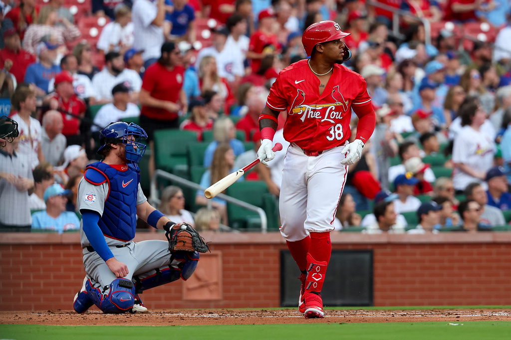 St. Louis Cardinals' Nelson Velázquez, right, watches his three-run home run ball during the first inning of a baseball game against the Chicago Cubs, Friday, May 29, 2026, in St. Louis. (AP Photo/Scott Kane)