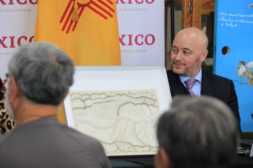 Justin Garris, Special Agent in Charge of the FBI Albuquerque field office, listens to a presentation on a centuries-old map during a ceremony in Albuquerque, New Mexico, on Tuesday, Sept. 23, 2025. (AP Photo/Susan Montoya Bryan) Justin Garris, Special Agent in Charge of the FBI Albuquerque field office, listens to a presentation on a centuries-old map during a ceremony in Albuquerque, New Mexico, on Tuesday, Sept. 23, 2025. (AP Photo/Susan Montoya Bryan)