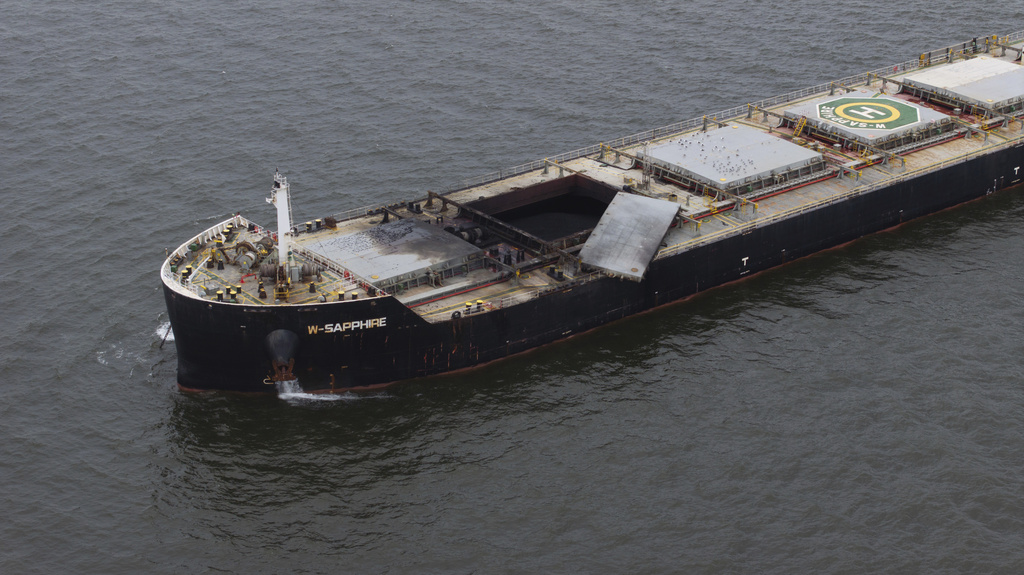 The W-Sapphire bulk carrier is seen anchored off Sandy Point, Md., the morning after an explosion occurred in one of its holds as it was leaving the Port of Baltimore, Tuesday, Aug. 19, 2025. (Jerry Jackson/The Baltimore Banner via AP)