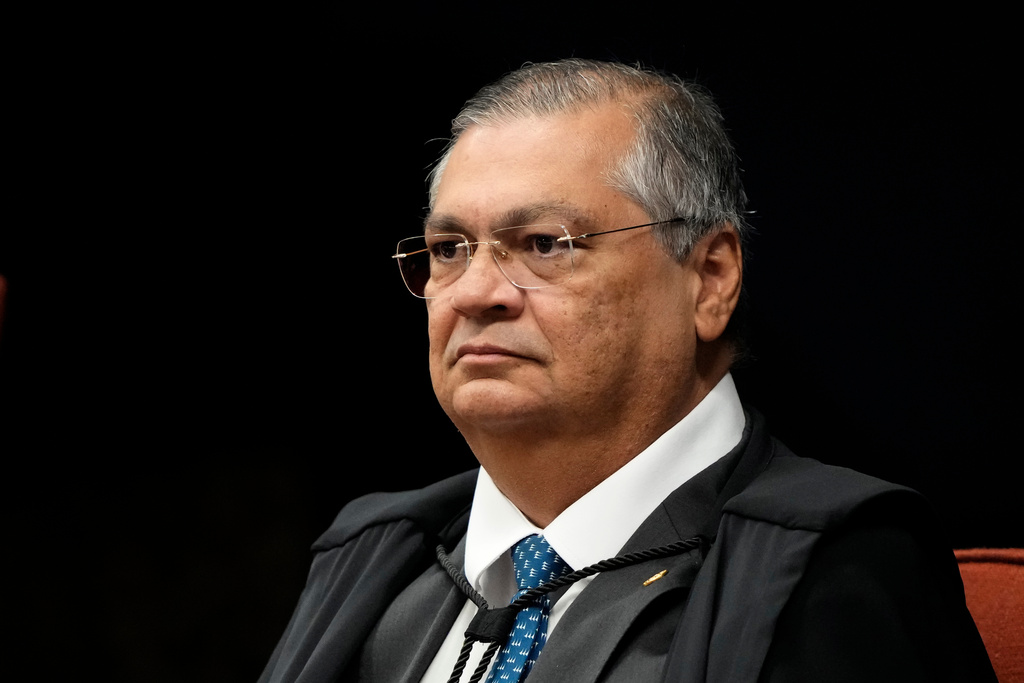 FILE - Supreme Court Justice Flavio Dino attends the verdict and sentencing phase of a trial for those charged in an alleged coup plot to keep former President Jair Bolsonaro in office after his 2022 election defeat, in Brasilia, Brazil, Sept. 9, 2025. (AP Photo/Eraldo Peres, File)