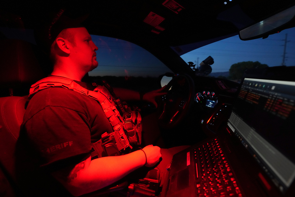 Cochise County Sheriff's Deputy AJ Shaw drives during a patrol, Tuesday, June 17, 2025, in Naco, Ariz. (AP Photo/Ross D. Franklin)