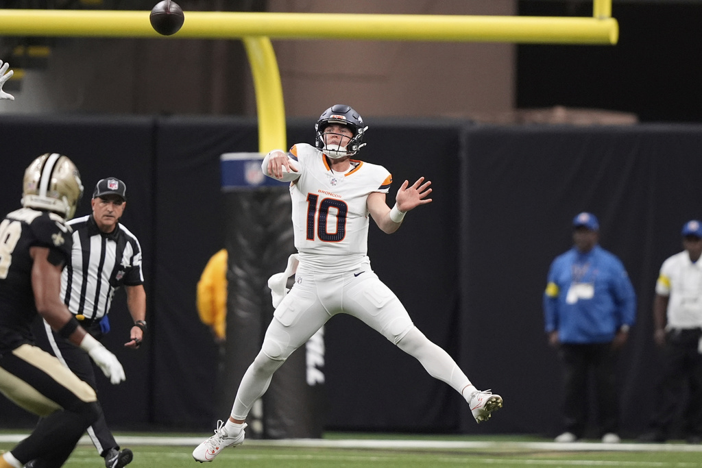 Denver Broncos quarterback Bo Nix passes the ball against the New Orleans Saints in the first half of an NFL preseason football game Saturday, Aug. 23, 2025, in New Orleans. (AP Photo/Gerald Herbert)
