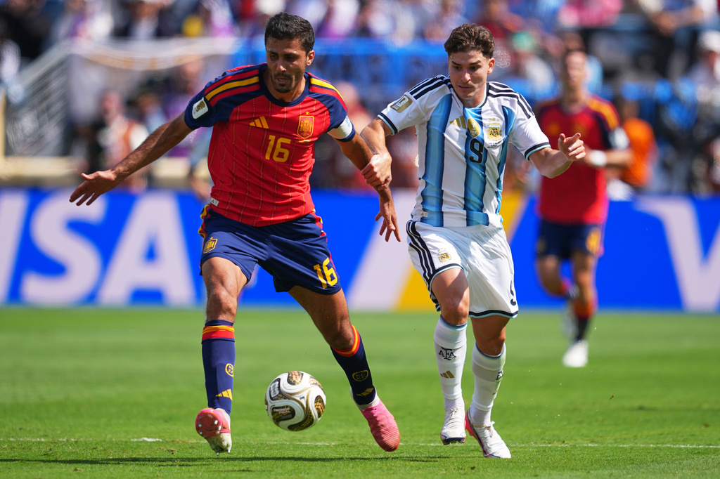 Spain's Rodri (16) vies for the ball against Argentina's Julian Alvarez (9) during the World Cup final soccer match between Spain and Argentina in East Rutherford, N.J., near New York, Sunday, July 19, 2026. (AP Photo/Julio Cortez)