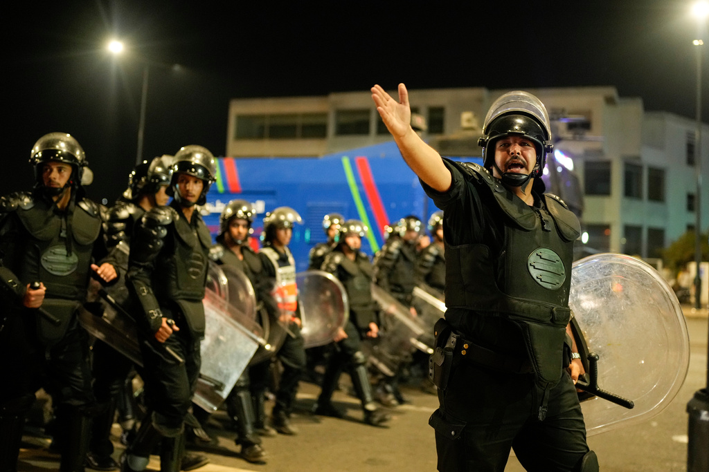 Security forces disperse a gathering as youth led protests calling for healthcare and education reforms turned violent, in Sale, Morocco, Wednesday, Oct. 1, 2025. (AP Photo/Mosa'ab Elshamy)