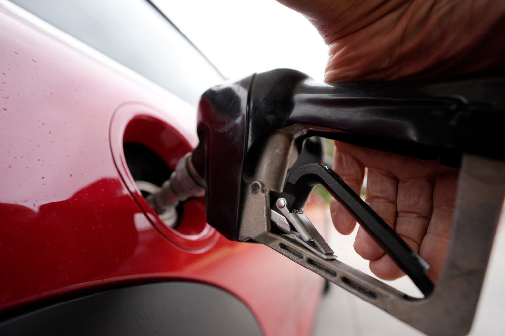 FILE - A motorist pumps fuel at a Shell station Wednesday, July 5, 2023, in Englewood, Colo. (AP Photo/David Zalubowski, File)