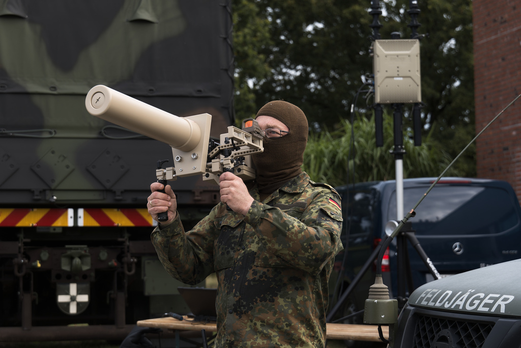 A Bundeswehr soldier presents the Counter UAV Jammer HP 47 on the second day of the large-scale German forces Bundeswehr exercise "Red Storm Bravo" in Hamburg, Friday, Sept. 26, 2025. (Marcus Golejewski/dpa via AP)