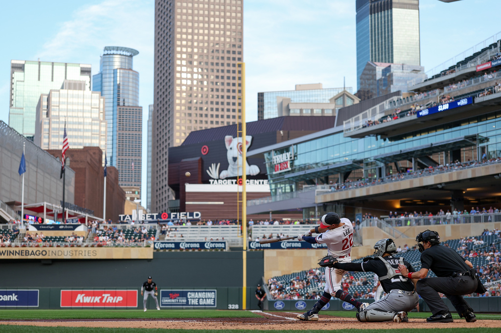 Minnesota Twins' Brooks Lee hits a sacrifice fly against the Chicago White Sox during the third inning of a baseball game, Tuesday, June 2, 2026, in Minneapolis. (AP Photo/Matt Krohn)