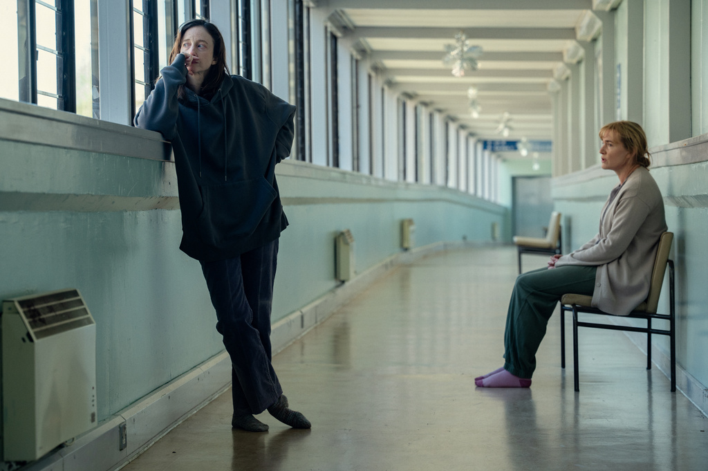 This image released by Netflix shows Andrea Riseborough, left, and Kate Winslet in a scene from "Goodbye June." (Netflix via AP)