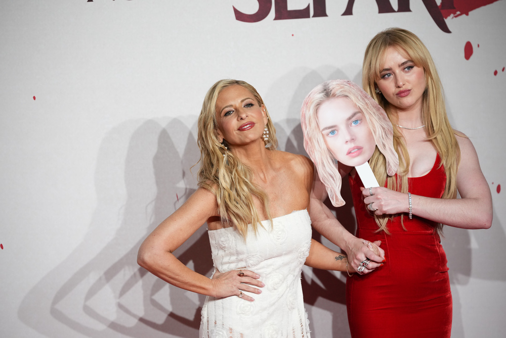 Sarah Michelle Gellar, Kathryn Newton pose on the red carpet for the Italian Premiere of Finche' morte non ci separi 2 (Ready or Not 2), in Rome, Monday, March 23, 2026. (AP Photo/Alessandra Tarantino)