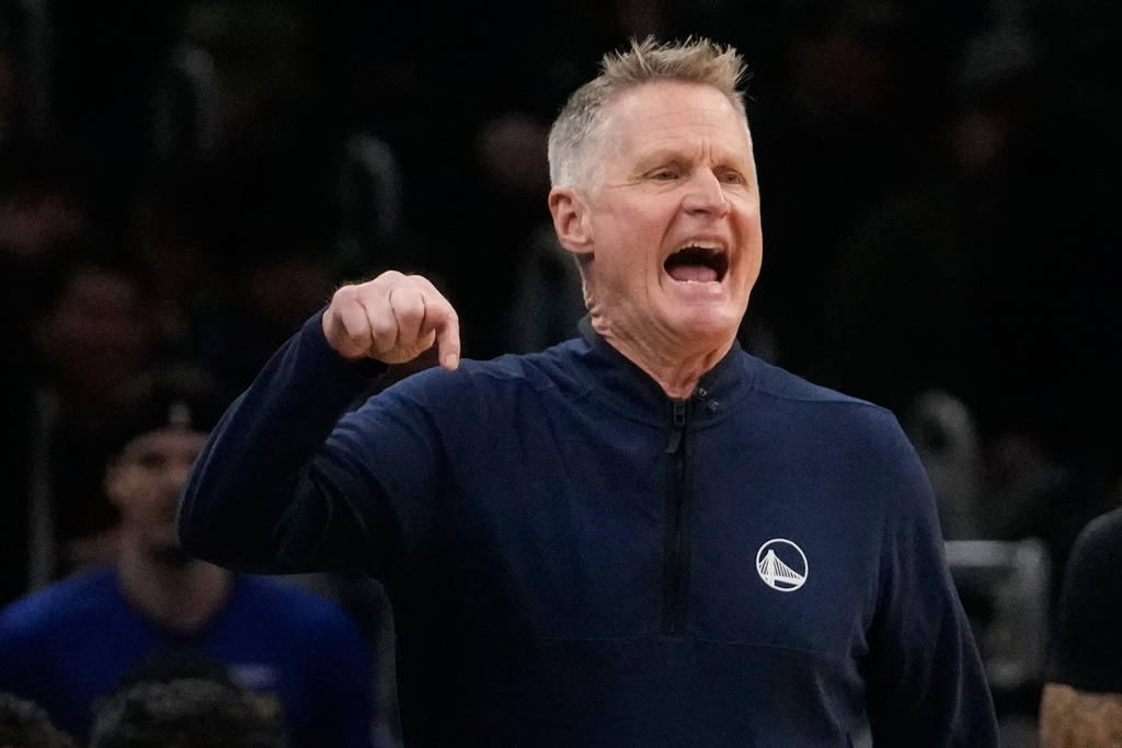 Golden State Warriors head coach Steve Kerr calls to his players during the first half of an NBA basketball game against the Boston Celtics, Wednesday, March 18, 2026, in Boston. (AP Photo/Charles Krupa)