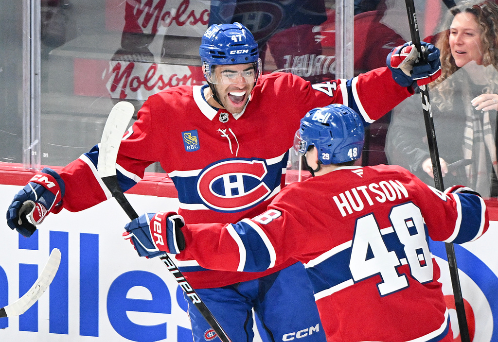 Montreal Canadiens' Jayden Struble (47) celebrates with teammate Lane Hutson (48) after scoring against the Columbus Blue Jackets during first-period NHL hockey game action in Montreal, Thursday, March 26, 2026. (Graham Hughes/The Canadian Press via AP)