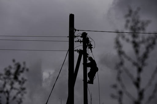 A worker climbs a utility pole while repairing power lines damaged in a Russian attack, Thursday, Oct. 16, 2025, in Shostka, Ukraine. (AP Photo/Julia Demaree Nikhinson) A worker climbs a utility pole while repairing power lines damaged in a Russian attack, Thursday, Oct. 16, 2025, in Shostka, Ukraine. (AP Photo/Julia Demaree Nikhinson)