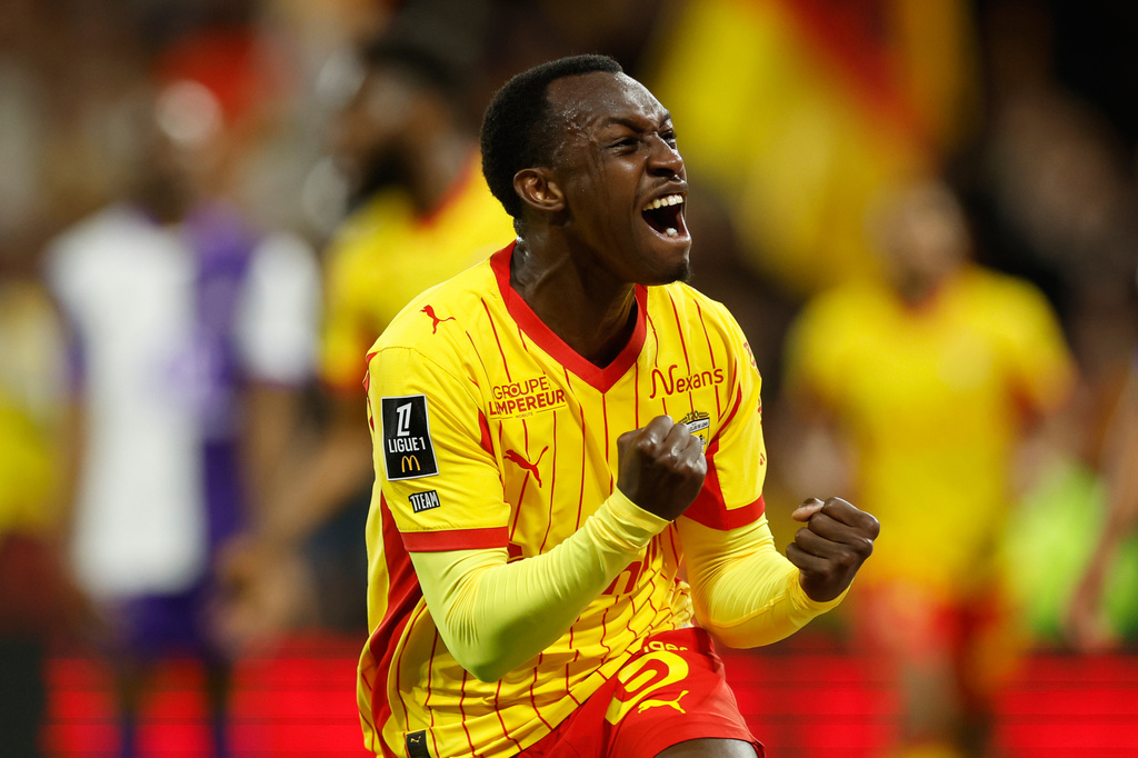 Lens' Saud Abdulhamid celebrates after scoring during a League One soccer match between Lens and Toulouse in Lens, France, Friday, April 17, 2026. (AP Photo/Jean-Francois Badias)