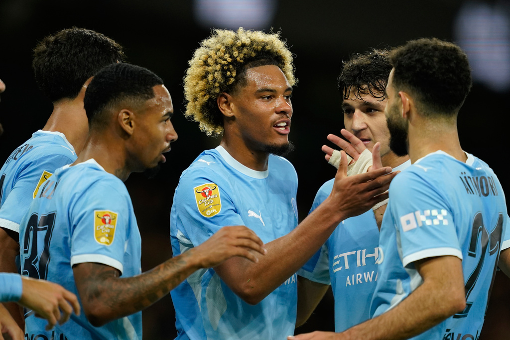 Manchester City's Floyd Samba, ceenter, celebrates after scoring first goal during the third-round English League Cup soccer match between Manchester City and Norwich City in Manchester, England, Thursday, Sept. 17, 2026. (AP Photo/Dave Thompson