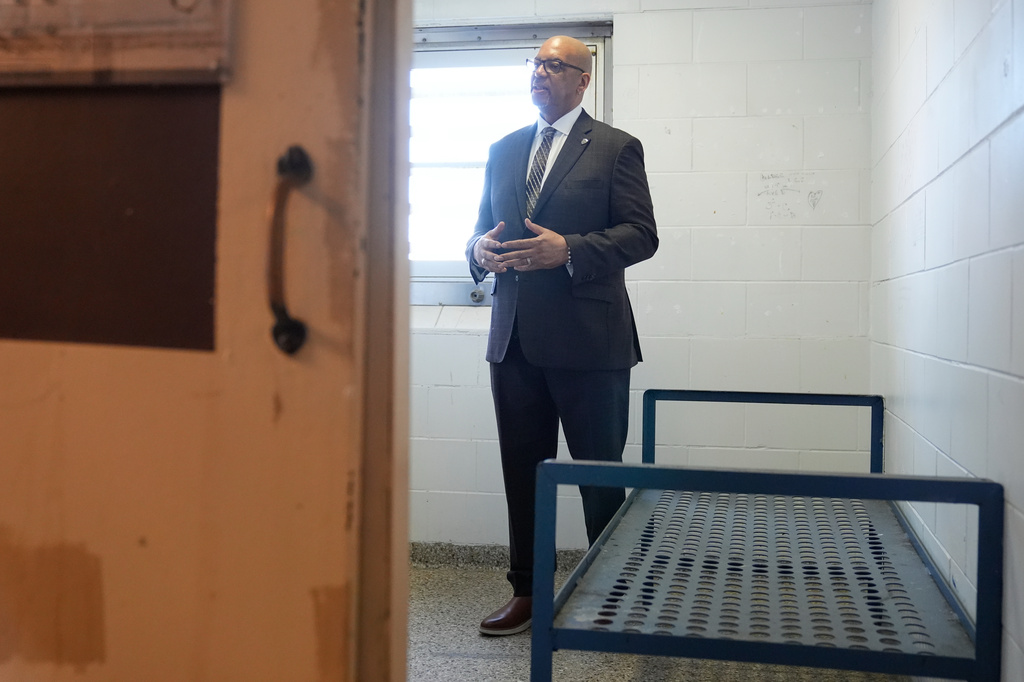 Stanley Richards, NYC Department of Correction commissioner talks to a reporters in the cell where he was previously incarcerated on Rikers Island in New York, Tuesday, April 14, 2026. (AP Photo/Seth Wenig)