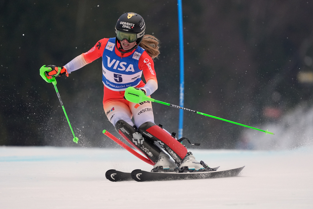 Switzerland's Camille Rast speeds down the course during an alpine ski, women's World Cup slalom, in Spindleruv Mlyn, Czech Republic, Sunday, Jan. 25, 2026. (AP Photo/Giovanni Auletta)