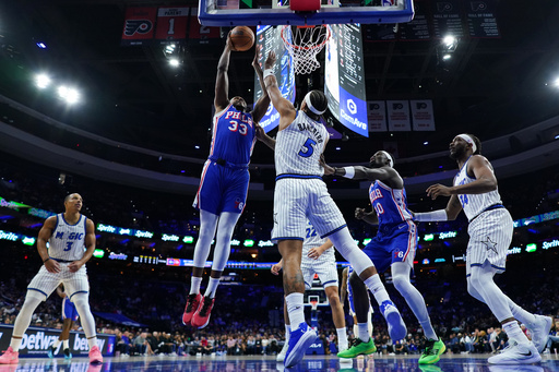 Philadelphia 76ers' Jabari Walker (33) goes up for a shot against Orlando Magic's Paolo Banchero (5) during the first half of an NBA basketball game Monday, Oct. 27, 2025, in Philadelphia. (AP Photo/Matt Slocum) Philadelphia 76ers' Jabari Walker (33) goes up for a shot against Orlando Magic's Paolo Banchero (5) during the first half of an NBA basketball game Monday, Oct. 27, 2025, in Philadelphia. (AP Photo/Matt Slocum)