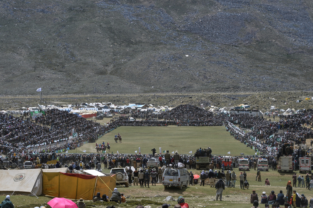 Spectators watch the final polo match between Chitral region team and Gilgit-Baltistan region team during the three-day annual Shandur Polo Festival in Shandur Pass, in the Ghizer district of Gilgit-Baltistan, northern Pakistan, Saturday, June 13, 2026. (AP Photo/Zubair Abbasi)