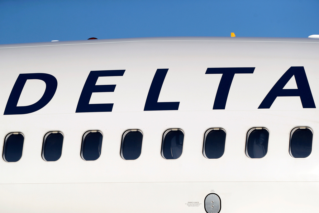 FILE - In this June 26, 2019, file photo, the company logo graces the side of a Delta Air Lines jetliner at Denver International Airport in Denver. (AP Photo/David Zalubowski, File)
